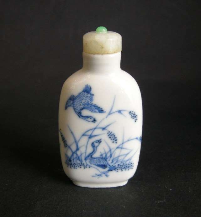 Snuff bottle painted in underglaze blue  of geeses in the millets